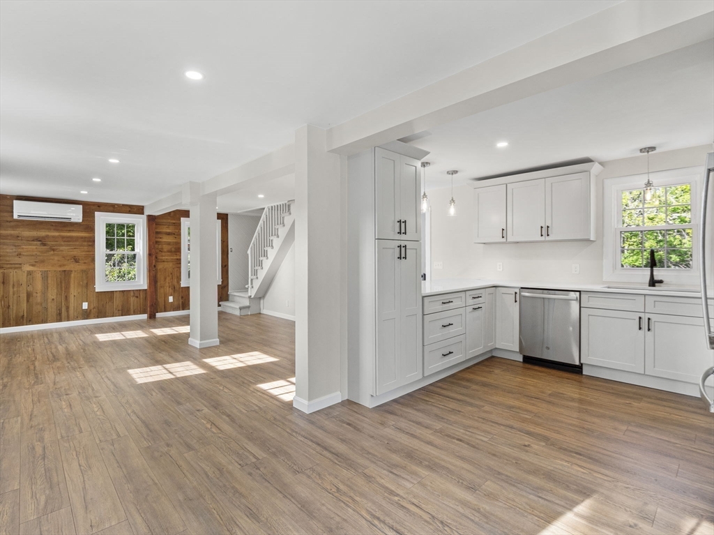 210 John Dyer Road Little Compton, RI 02837 - Photo 4 of 42 a view of a kitchen with wooden floor and electronic appliances