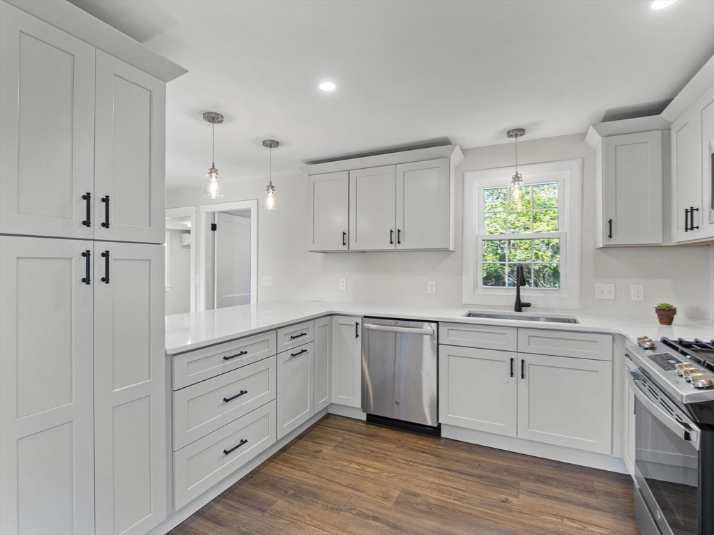 210 John Dyer Road Little Compton, RI 02837 - Photo 6 of 42 a kitchen with white cabinets and window