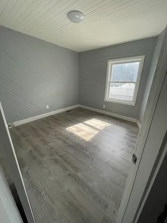 a view of an empty room and a window