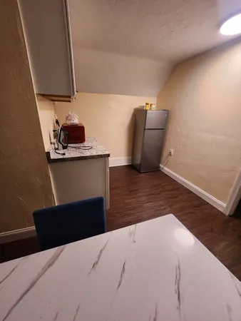 a room with furniture and a wooden floor
