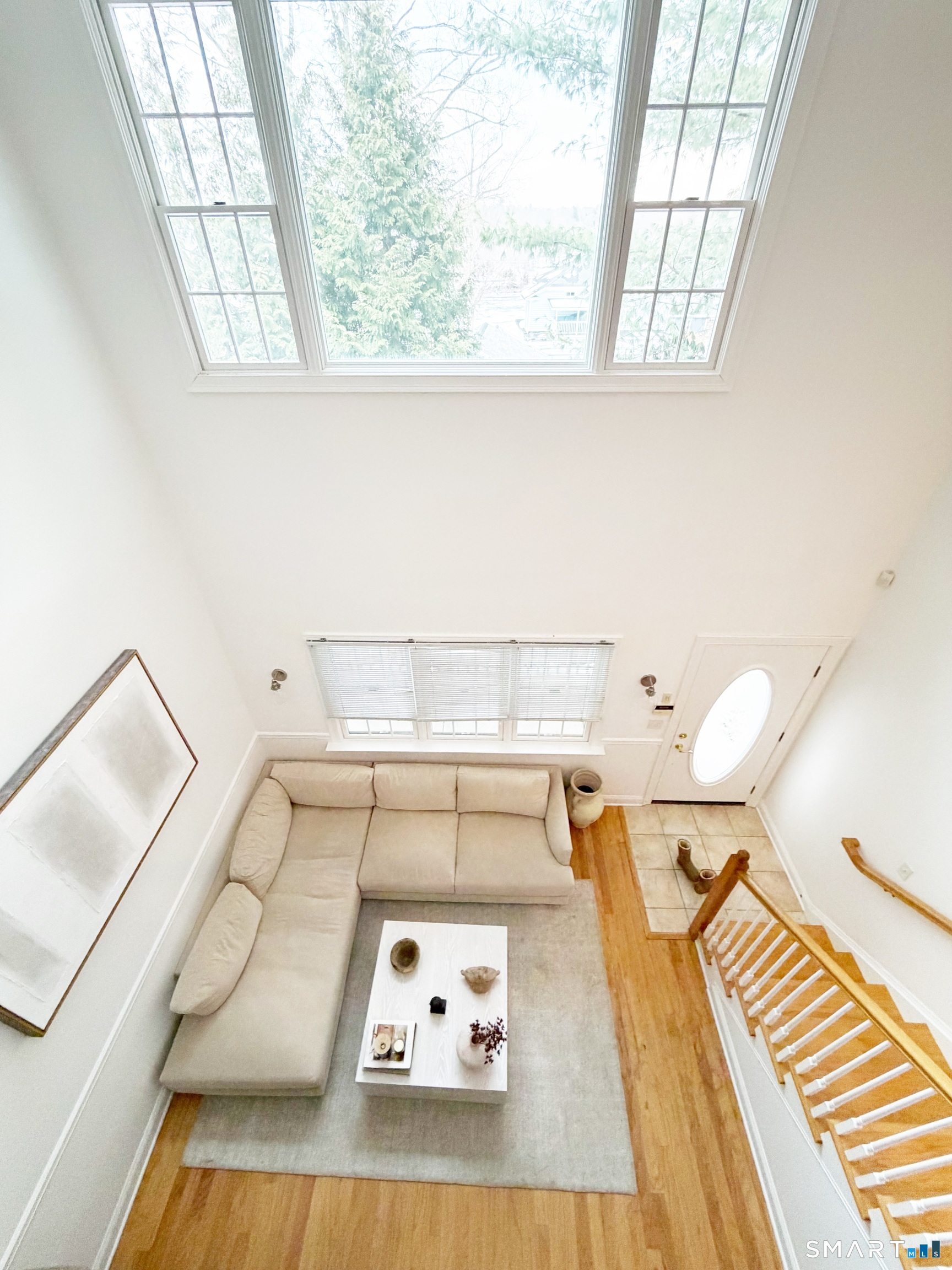 20 Cross Street, Unit 3 Westport, CT 06880 - Photo 11 of 20 a view of a living room with furniture and a book shelf