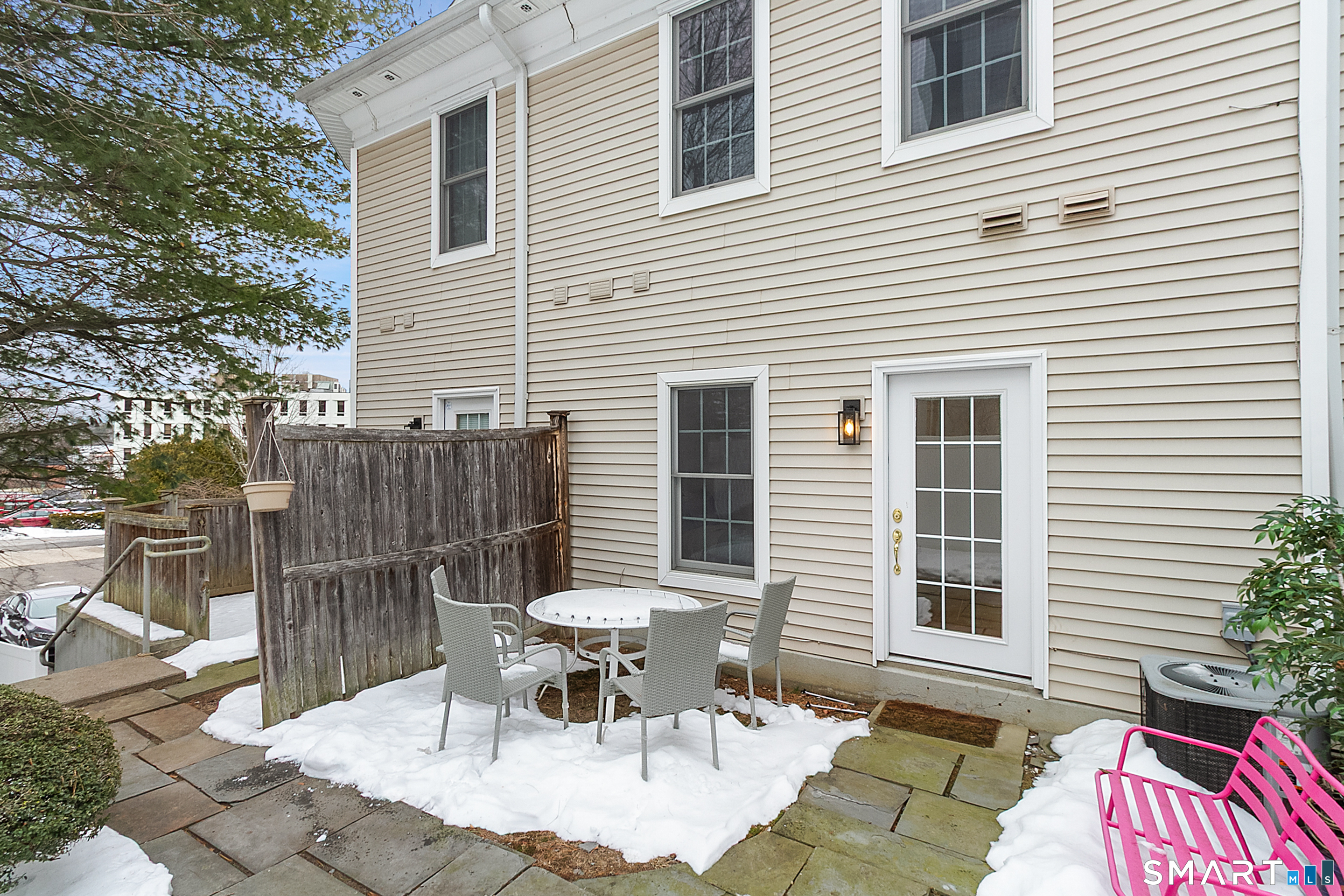 20 Cross Street, Unit 3 Westport, CT 06880 - Photo 19 of 20 a view of a patio with a table and chairs