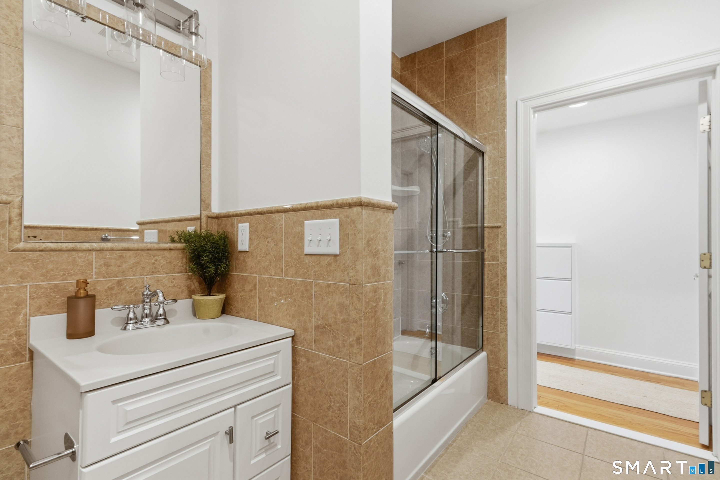 20 Cross Street, Unit 3 Westport, CT 06880 - Photo 8 of 20 a bathroom with a bathtub and a sink