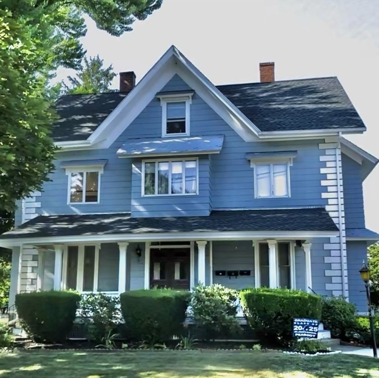 4 Gardner Street, Unit 2 Peabody, MA 01960 - Photo 1 of 13 a front view of a house with a yard