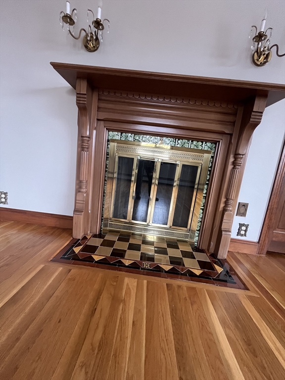 4 Gardner Street, Unit 2 Peabody, MA 01960 - Photo 12 of 13 a living room with a furniture large window and wooden floor