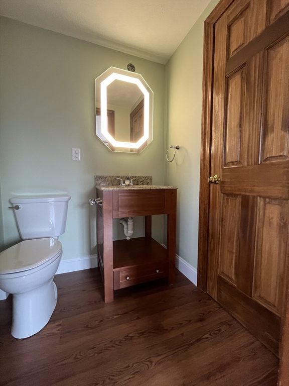 4 Gardner Street, Unit 2 Peabody, MA 01960 - Photo 10 of 13 a bathroom with a toilet a sink and mirror