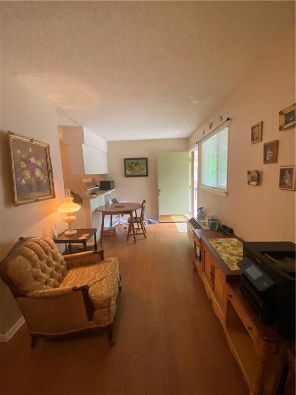 400 West 34th Street, Unit 201 Austin, TX 78705 - Photo 2 of 7 a living room with furniture and a flat screen tv