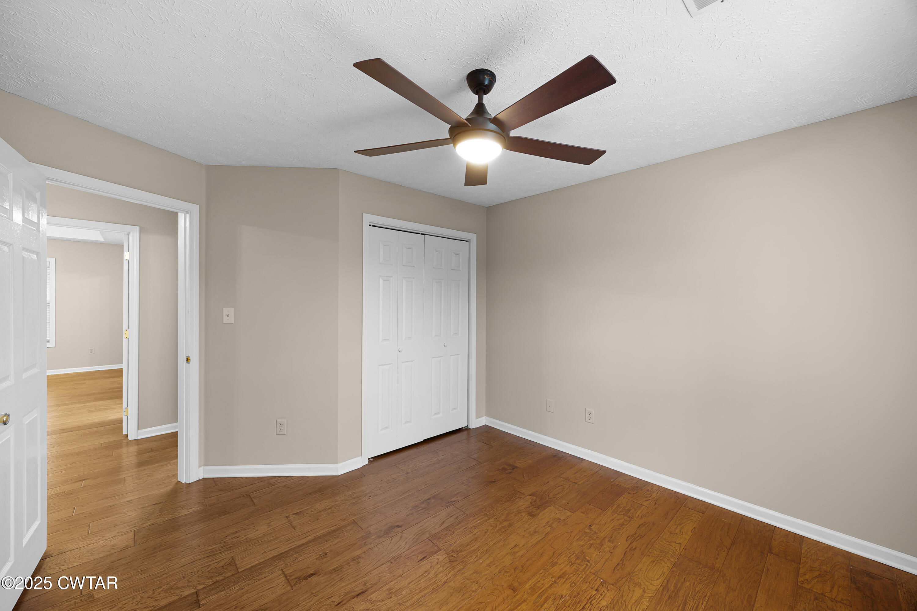 98 Cotton Ridge Drive Jackson, TN 38305 - Photo 14 of 20 a view of an empty room with wooden floor