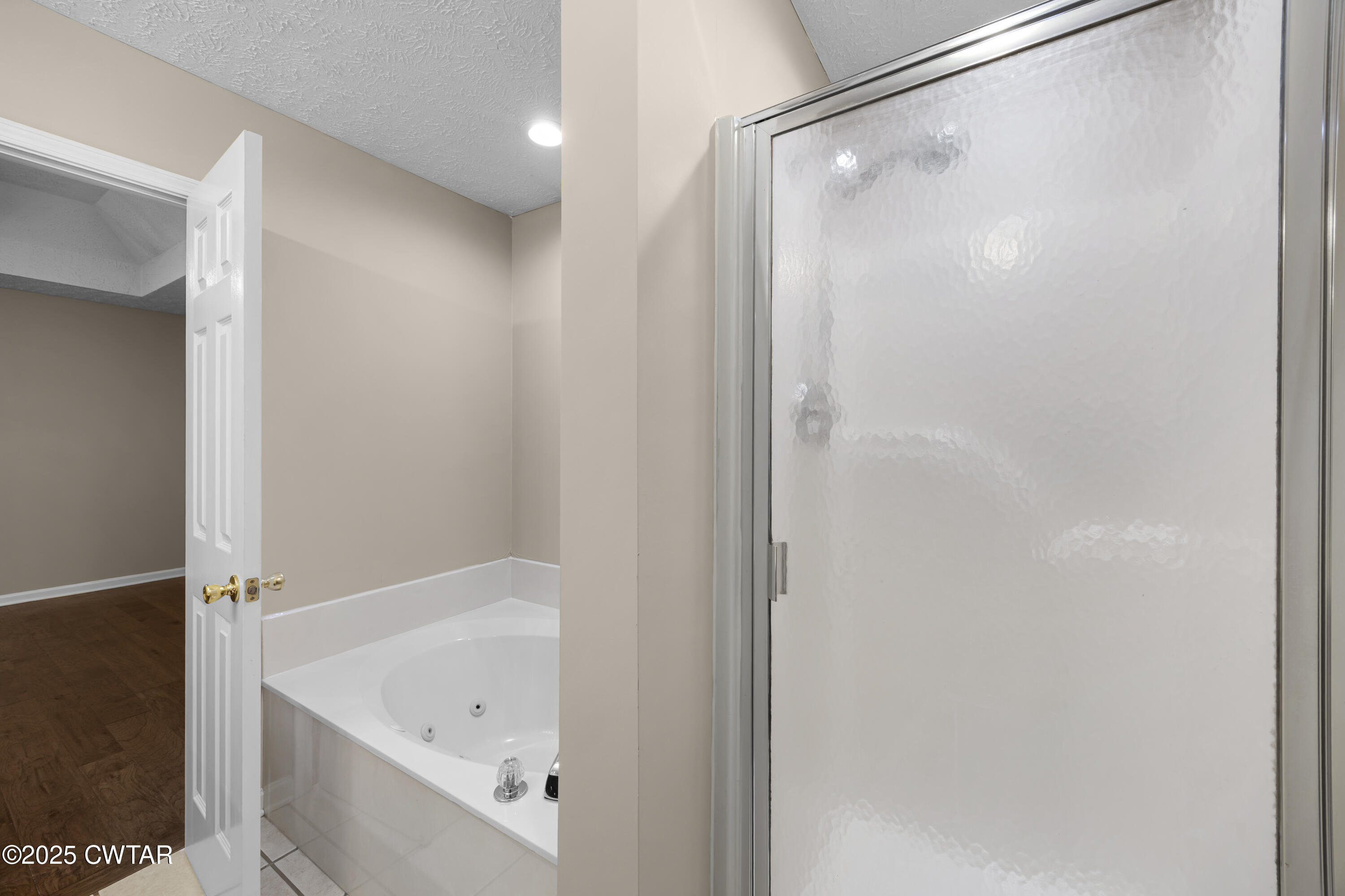 98 Cotton Ridge Drive Jackson, TN 38305 - Photo 20 of 20 a bathroom with a bathtub and a shower