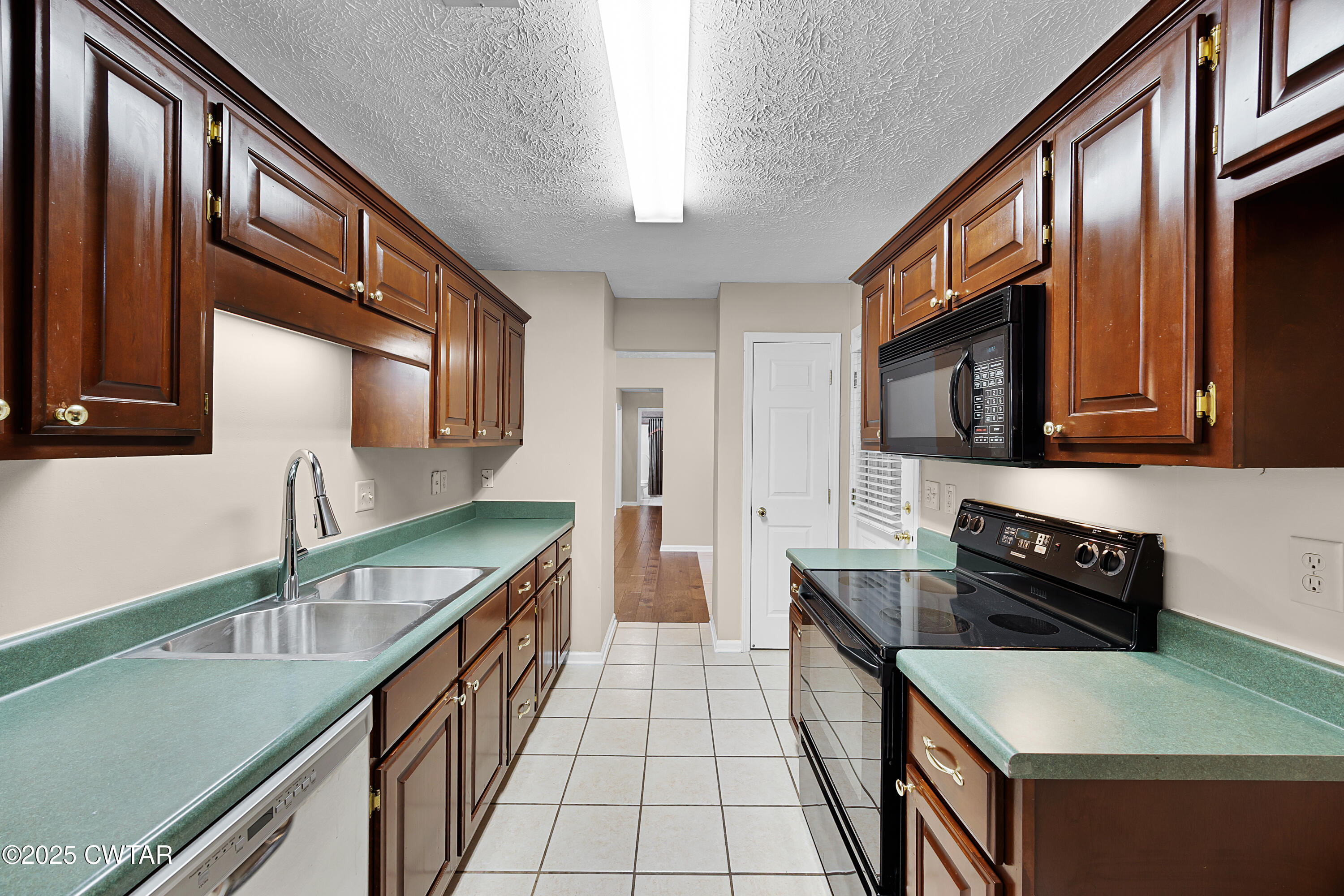 98 Cotton Ridge Drive Jackson, TN 38305 - Photo 10 of 20 a kitchen with stainless steel appliances granite countertop a sink and stove