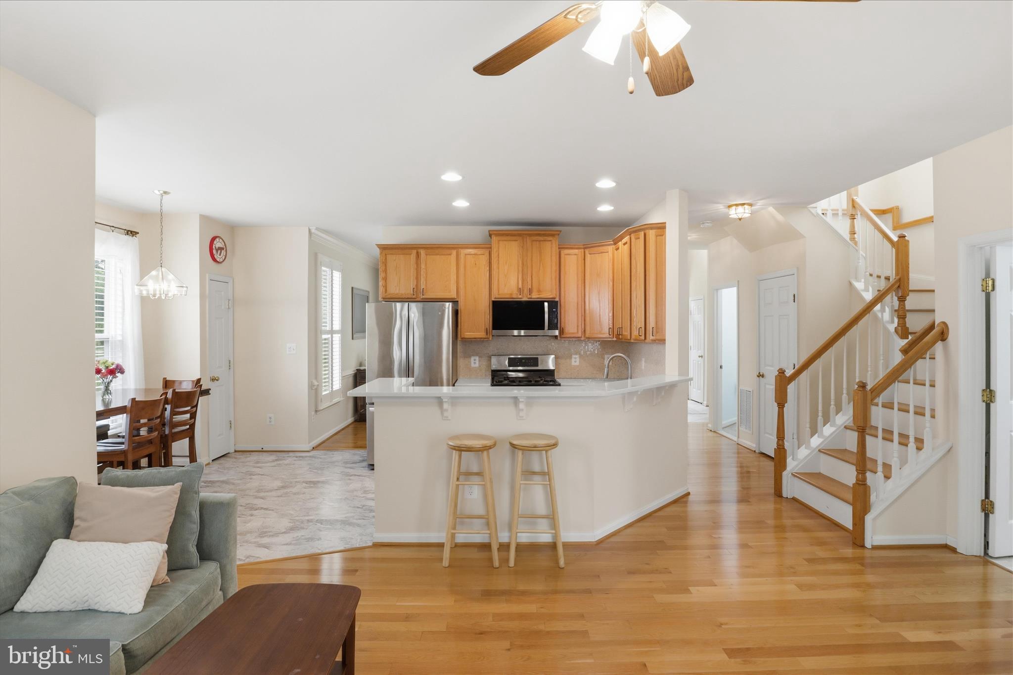 25352 Ripleys Field Drive Chantilly, VA 20152 - Photo 3 of 54 a living room with stainless steel appliances kitchen island granite countertop a living room view and living room view