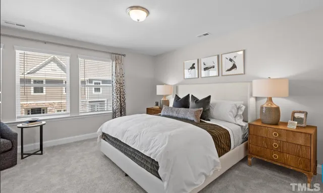 a spacious bedroom with a bed and a window