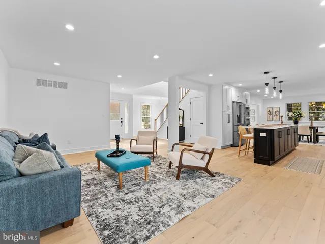 a kitchen with stainless steel appliances a sink a stove and a refrigerator