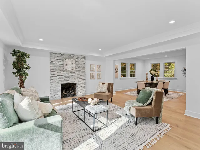 a bathroom with a toilet a sink and a window