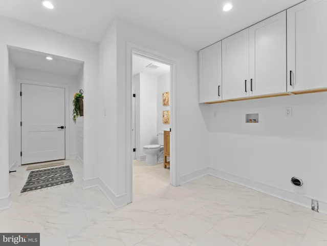 a spacious bedroom with a large bed and a window