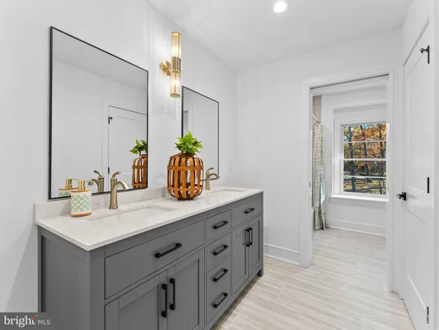 a backyard of a house with large trees and parked