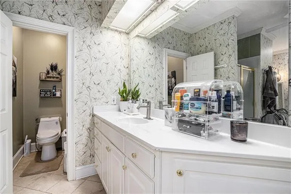 a view of bathroom with a sink toilet and shower