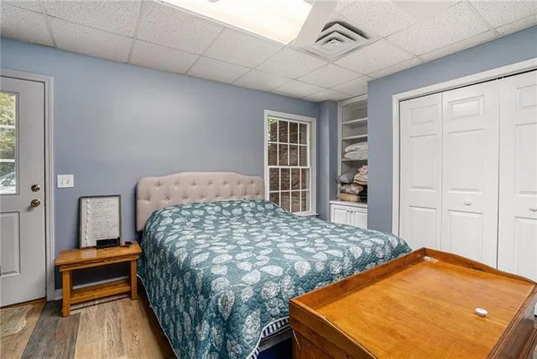 a bedroom with a bed and a dresser