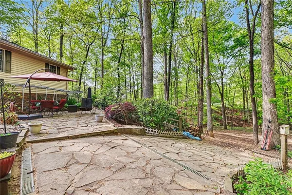 a view of backyard with patio