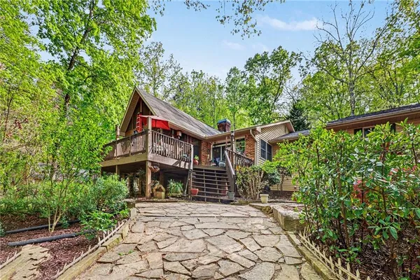a view of house with yard and entertaining space