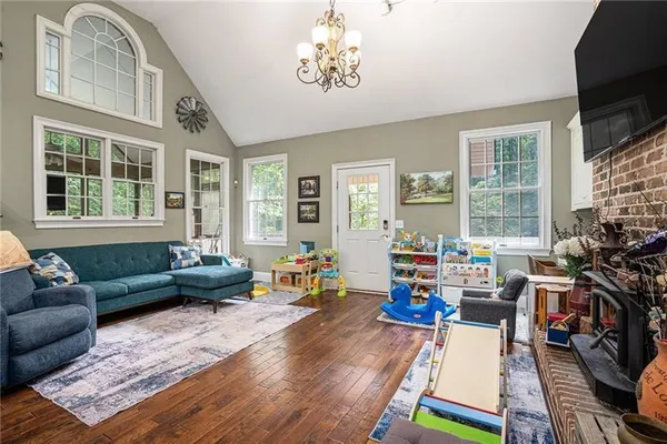 a living room with furniture and a flat screen tv