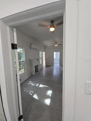 a view of empty room with large windows