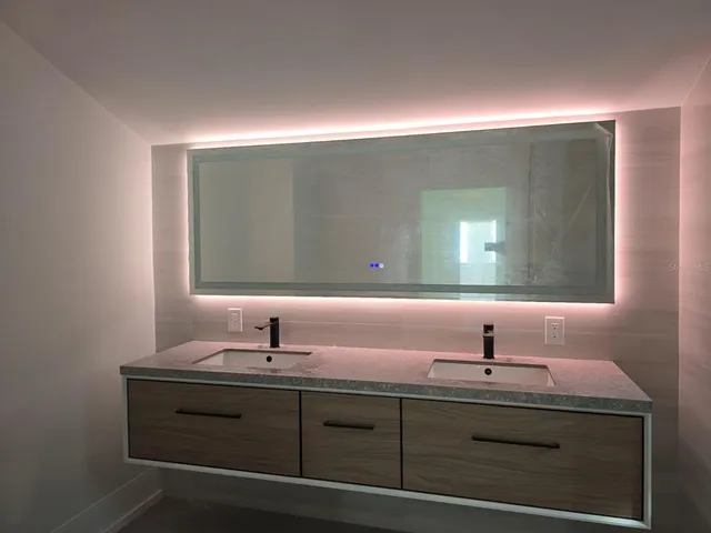 a bathroom with a sink and a mirror