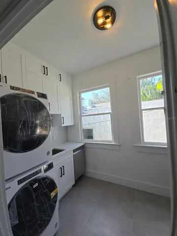 a utility room with a window dryer and washer