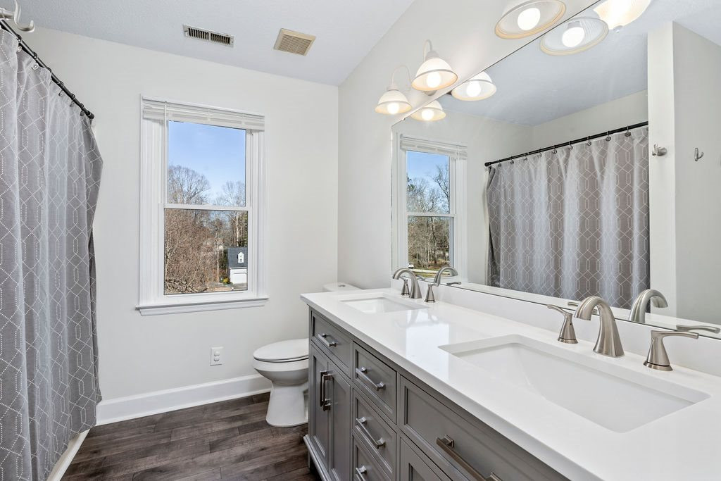 1605 Habbot Drive Raleigh, NC 27603 - Photo 16 of 30 Stylish Master Bathroom with His and Her Vanity Sinks