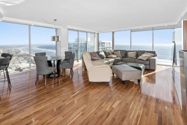 a living room with fireplace furniture and a wooden floor