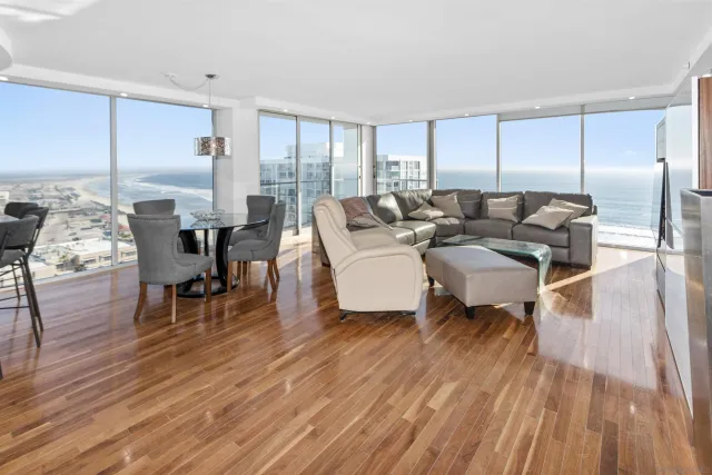 a living room with fireplace furniture and a wooden floor