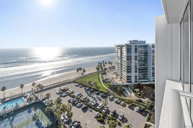 a view of ocean with a multi story building