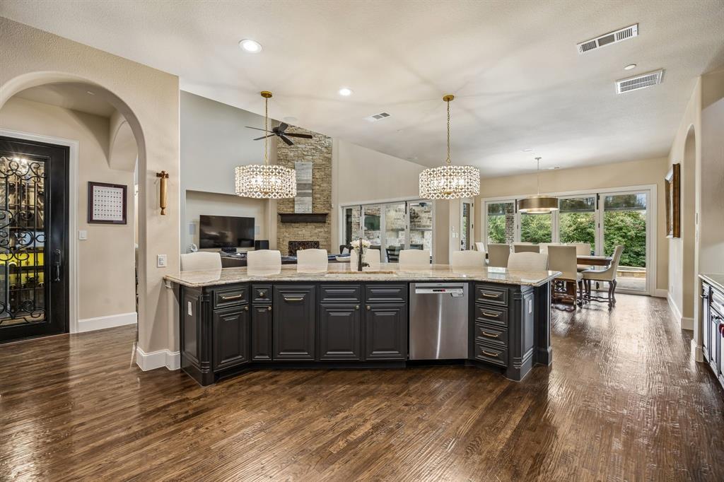 1005 Berkshire Road Southlake, TX 76092 - Photo 12 of 40 a kitchen with stainless steel appliances granite countertop a stove oven and a refrigerator