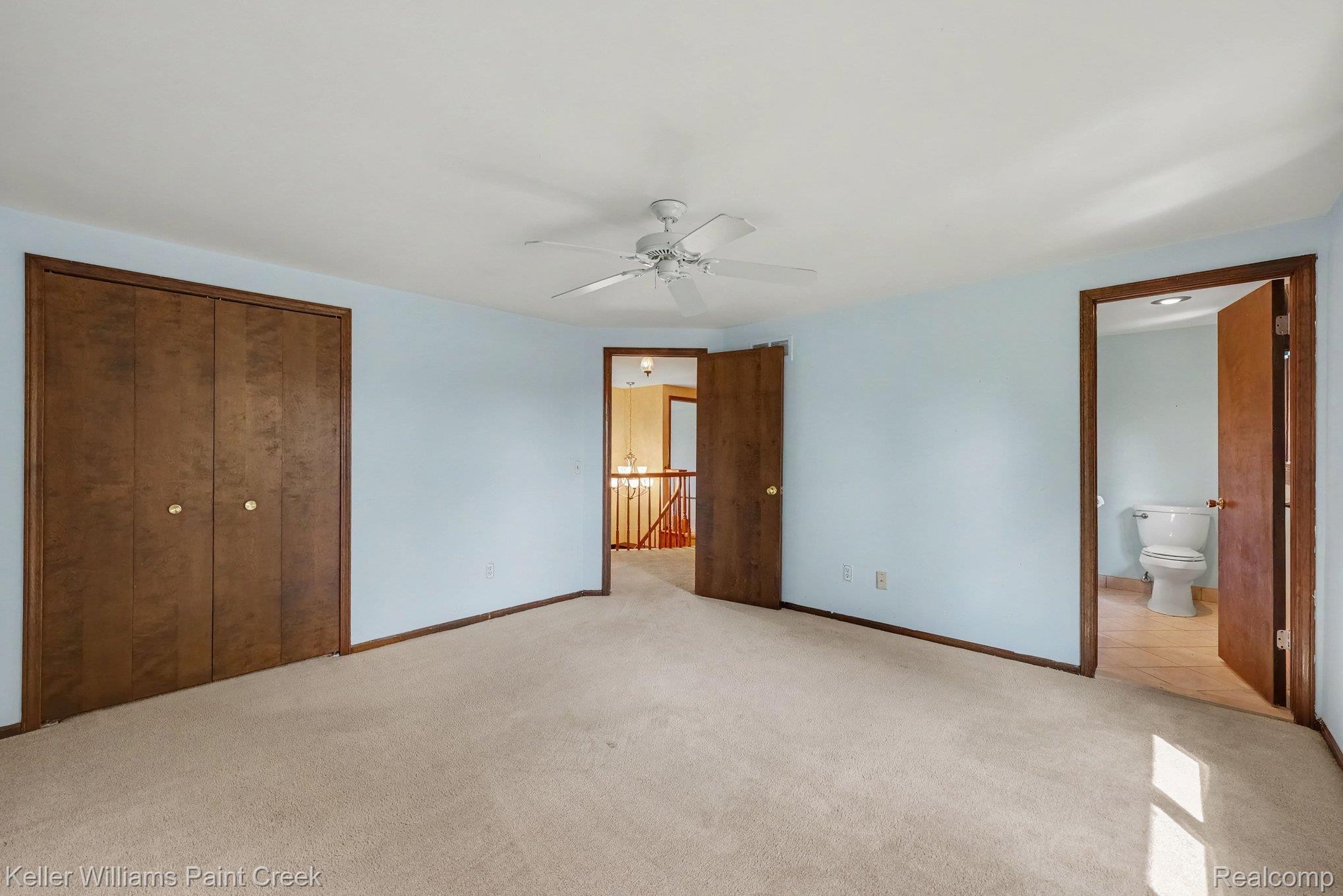 2717 Powderhorn Ridge Road Rochester, MI 48309 - Photo 18 of 48 Light-colored carpeting with wooden trim