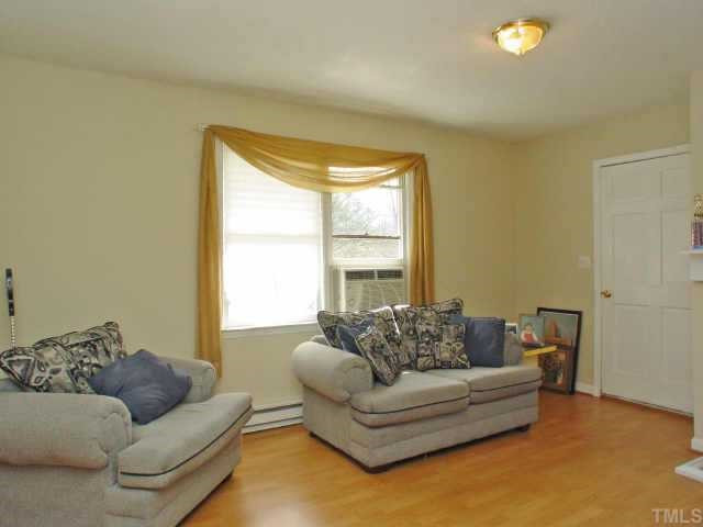 318 Sandy Raleigh, NC 27610 - Photo 3 of 9 a living room with furniture and a window