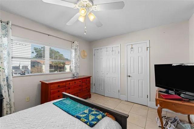 a bedroom with a bed and a table in it