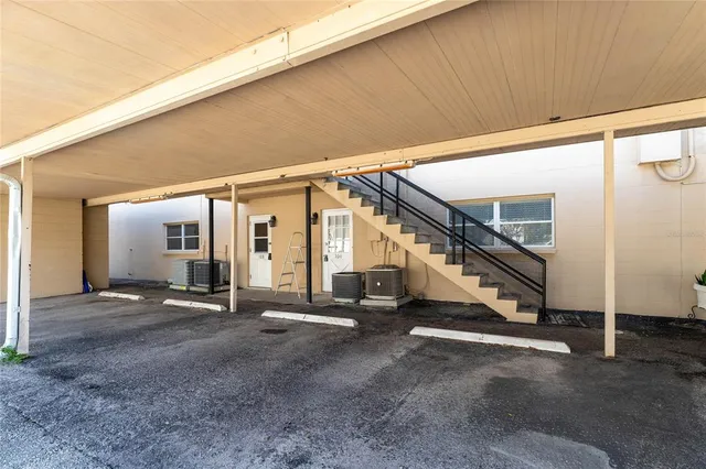 a view of an empty room with stairs