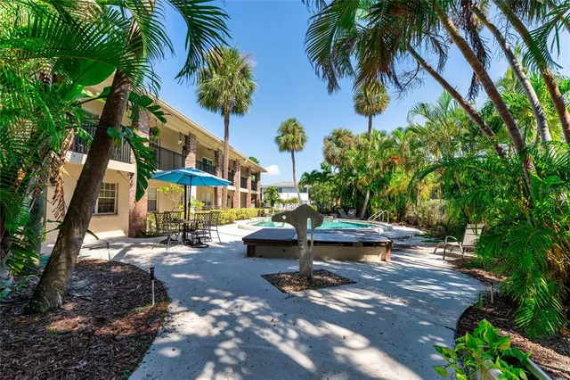 a living room with furniture and a gym equipment