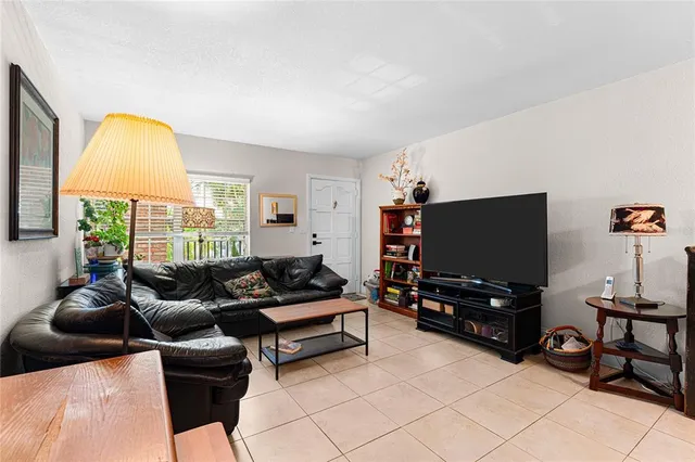 a view of a hallway with workspace and a window