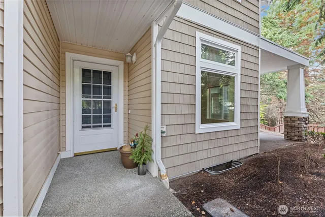 a view of house with backyard