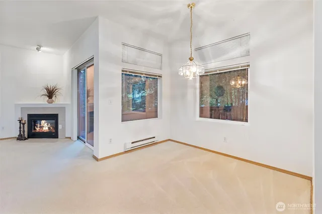 a view of a room with window and fireplace