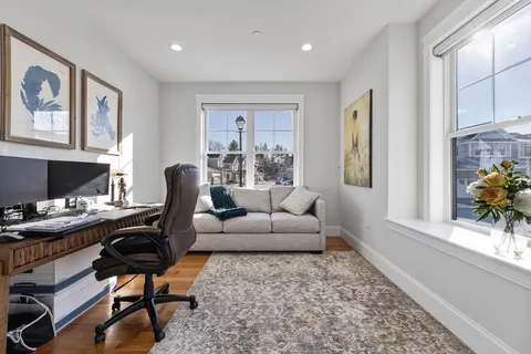 a living room with furniture and a lamps