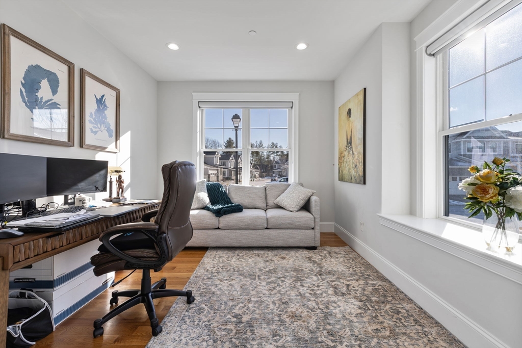 15 Rowell Lane, Unit 15 Middleton, MA 01949 - Photo 14 of 39 a living room with furniture and a lamps