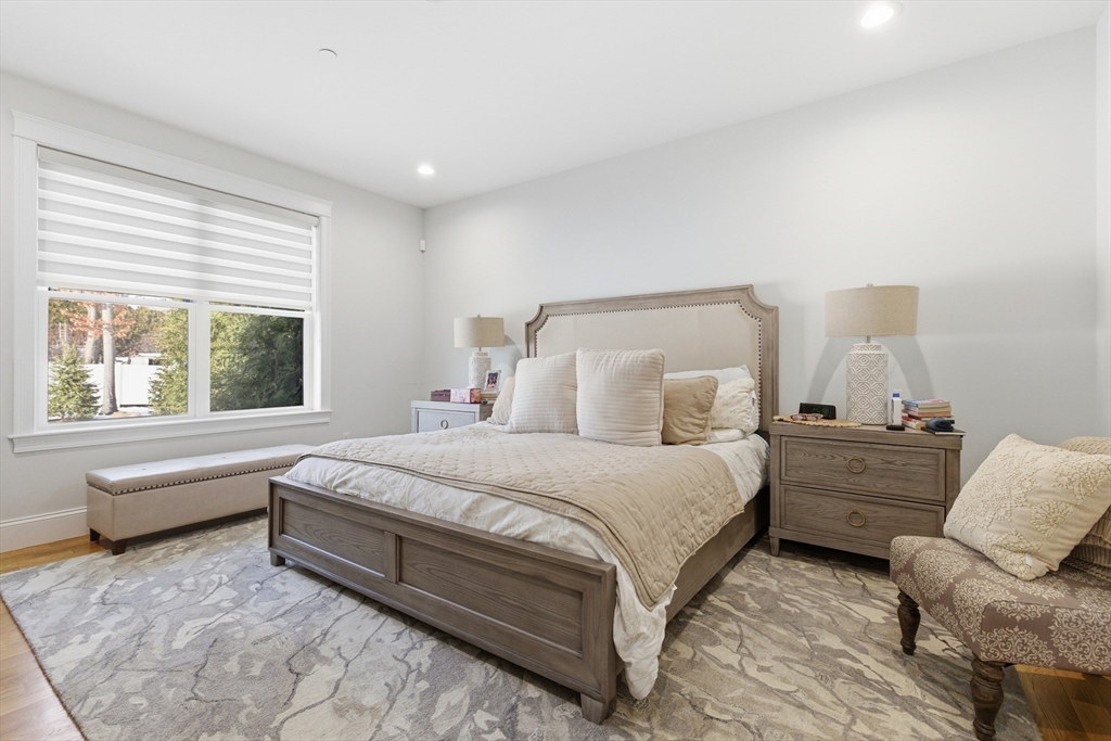 15 Rowell Lane, Unit 15 Middleton, MA 01949 - Photo 16 of 39 a bed room with a bed and a couch