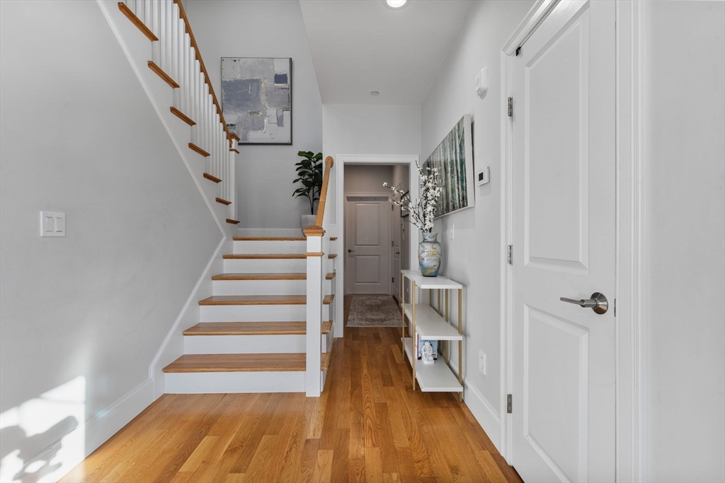 15 Rowell Lane, Unit 15 Middleton, MA 01949 - Photo 22 of 39 a view of entryway with wooden floor and stairs