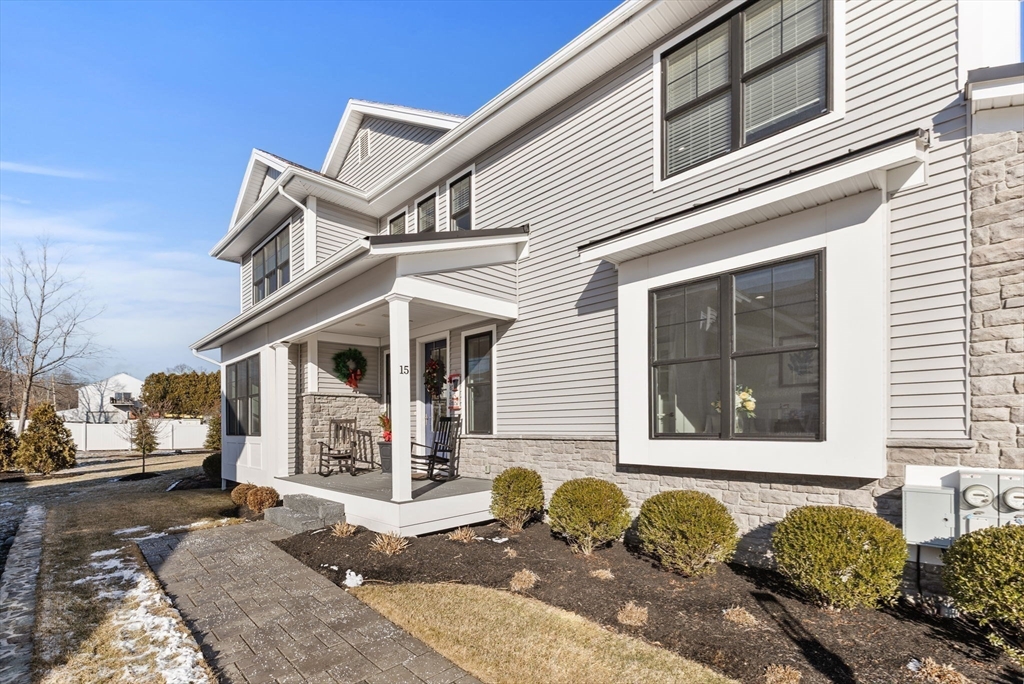 15 Rowell Lane, Unit 15 Middleton, MA 01949 - Photo 38 of 39 a front view of a house with garden