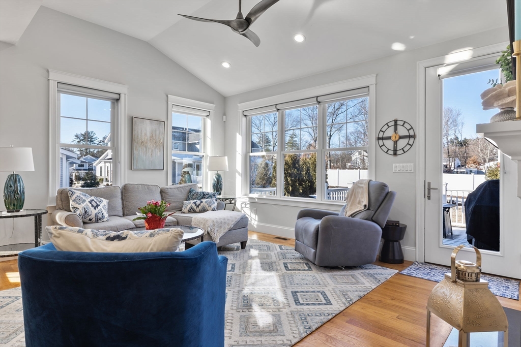 15 Rowell Lane, Unit 15 Middleton, MA 01949 - Photo 6 of 39 a living room with furniture flat screen tv and a large window