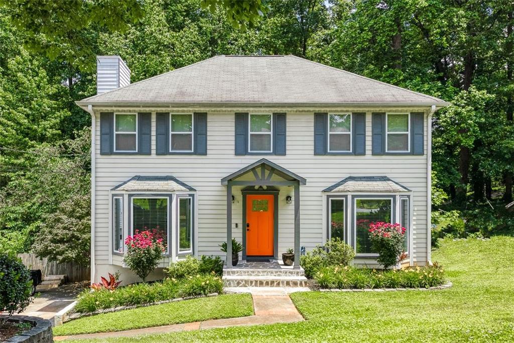 1029 Pointer Ridge Tucker, GA 30084 - Photo 1 of 1 a front view of a house with garden