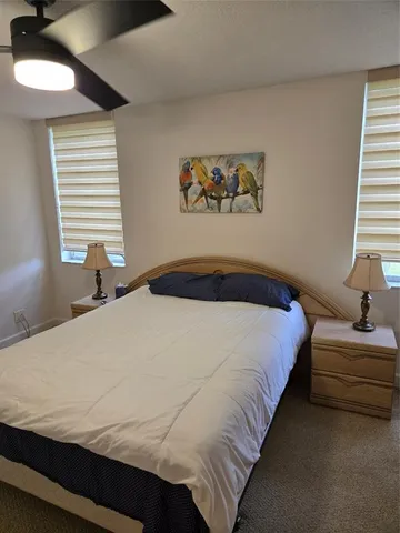 a view of a tree in front of a house