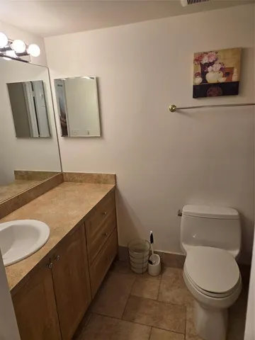 a view of a yard with lawn chairs and a fire pit